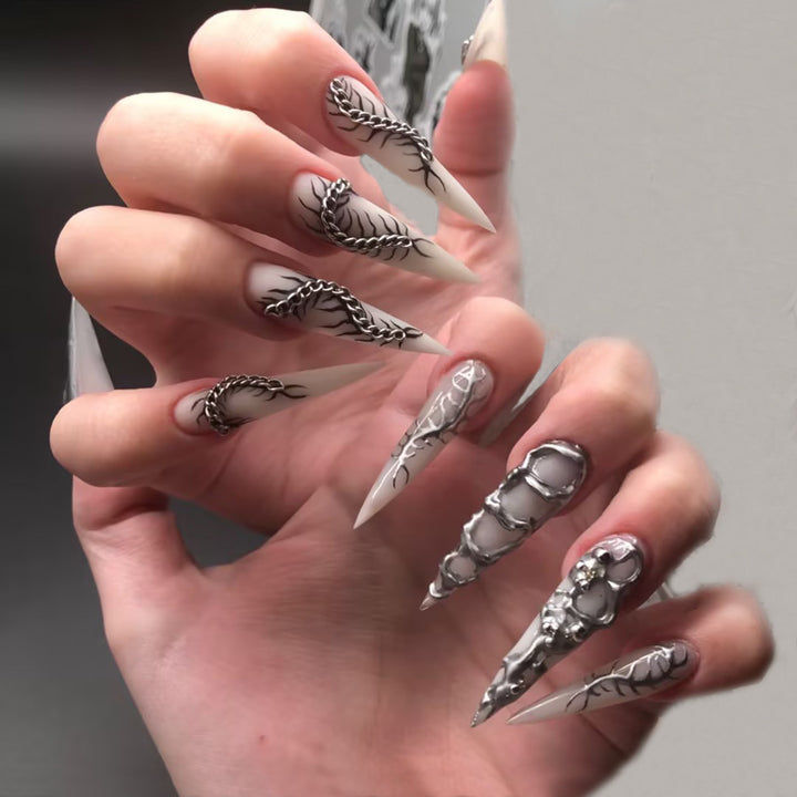 Creative nail art set with elegant floral designs and metallic accents Kalsten