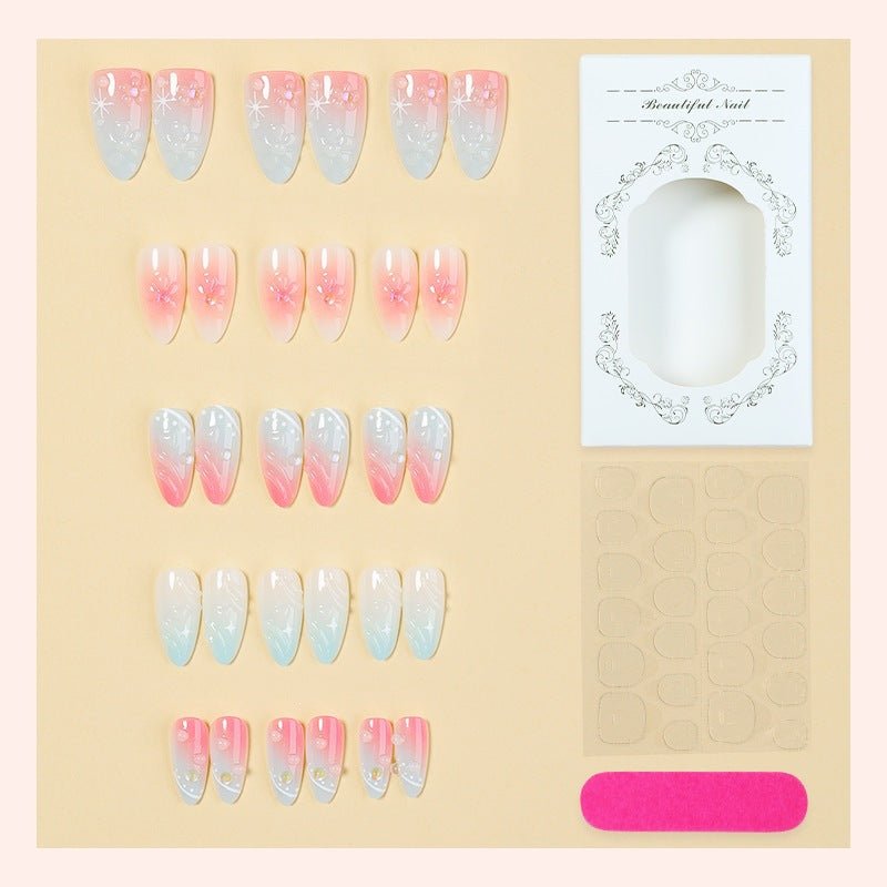 Acrylic nail set with elegant ombre design and floral decorations Kalsten