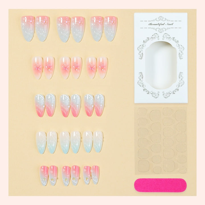 Acrylic nail set with elegant ombre design and floral decorations Kalsten