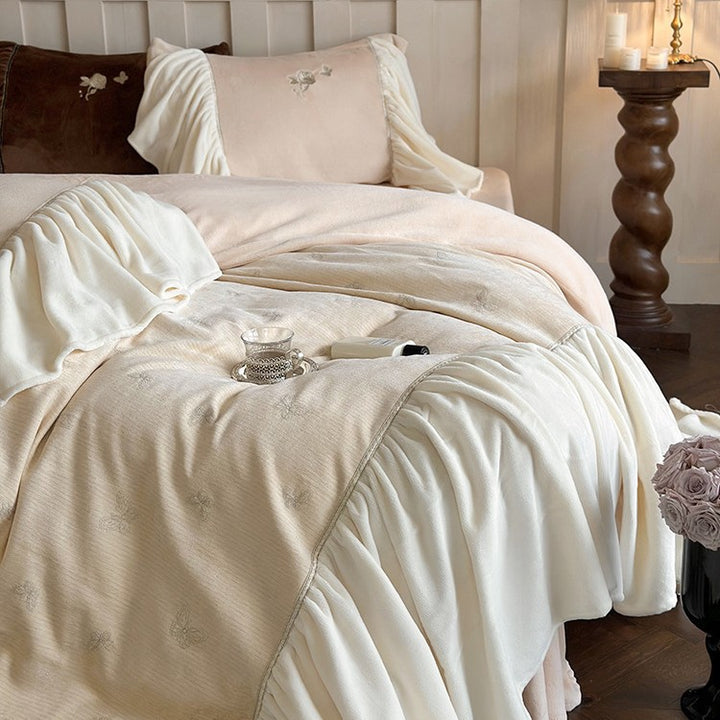 Satin bedding set with gathered ruffles and delicate butterfly embroidery