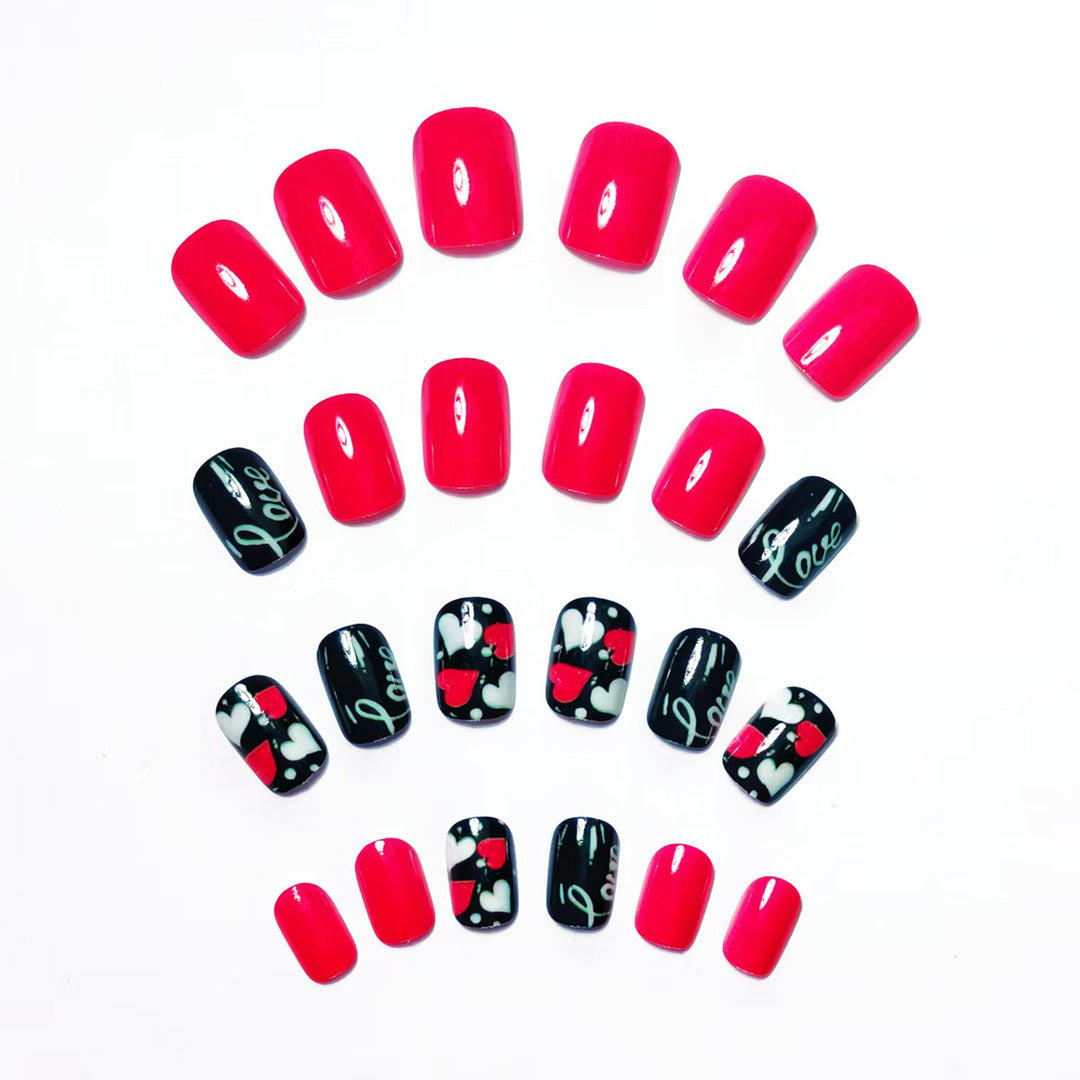Acrylic nail design with hearts and kiss motifs Kalsten