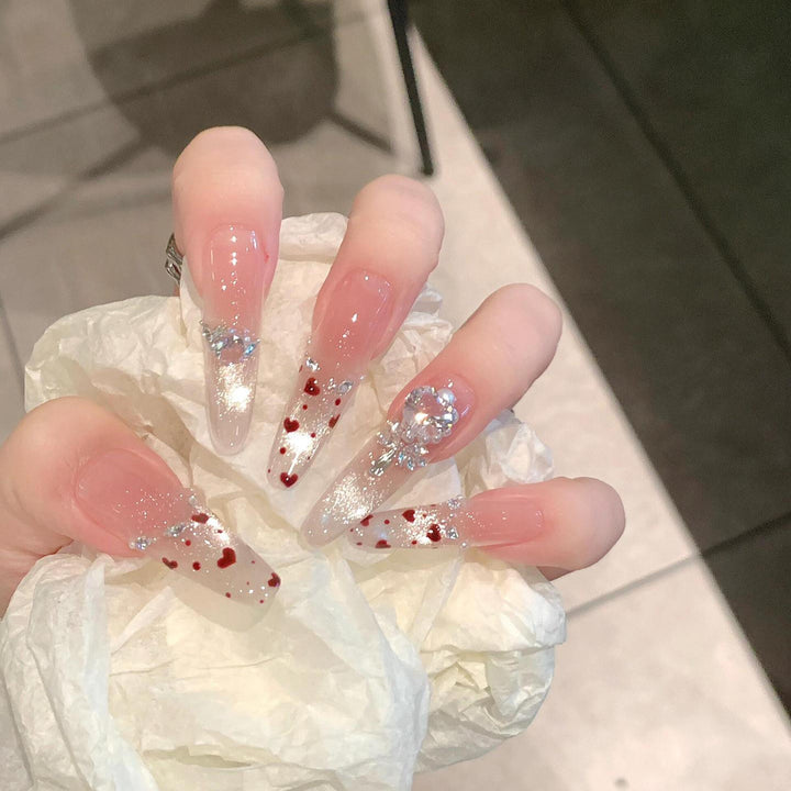Nail art set with sparkling rhinestones and heart design Kalsten