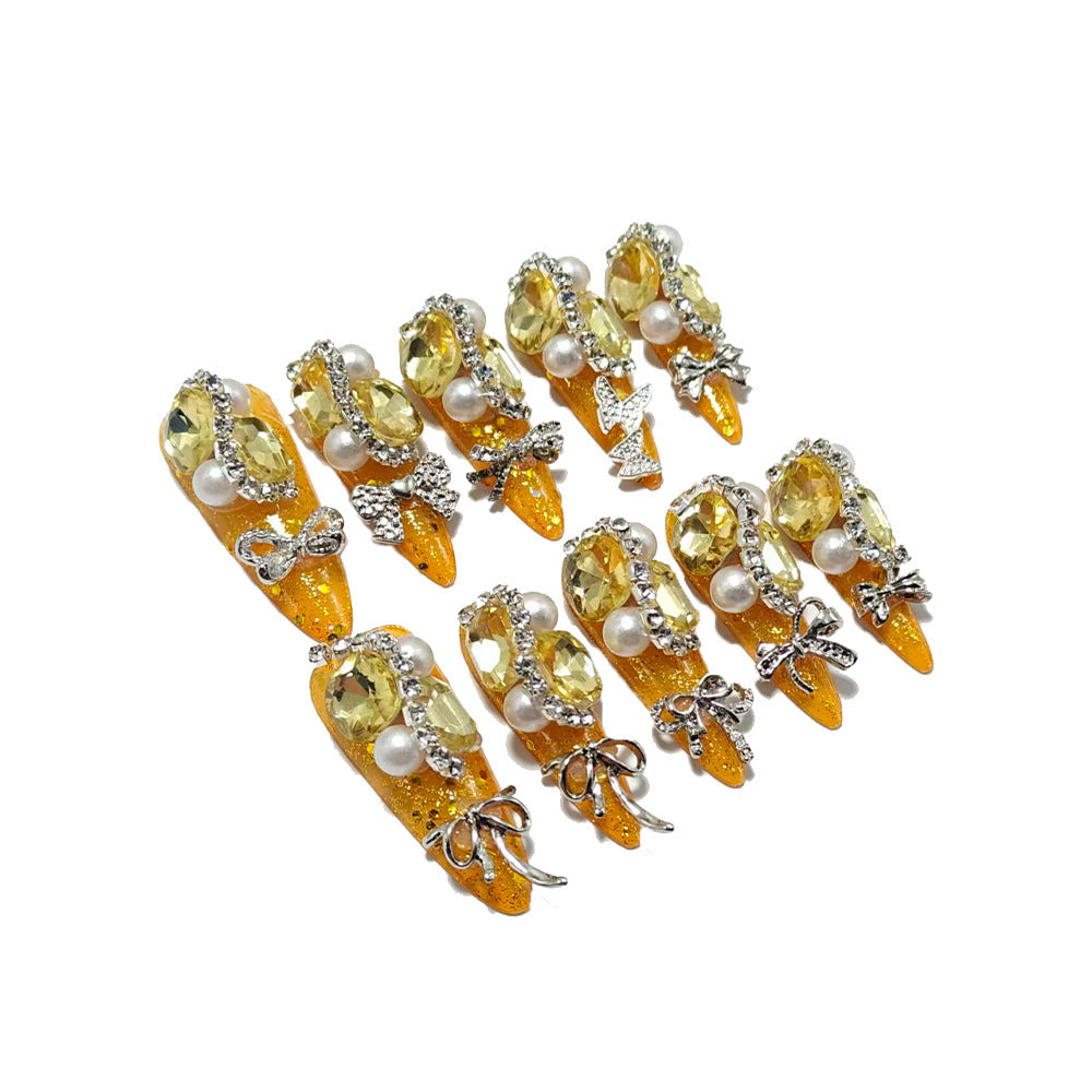 Glamorous artificial nails with rhinestones and pearl embellishments Kalsten
