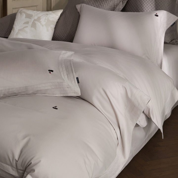 Fine-made duvet cover set made of Mako cotton with subtle monogram embroidery & pleated border