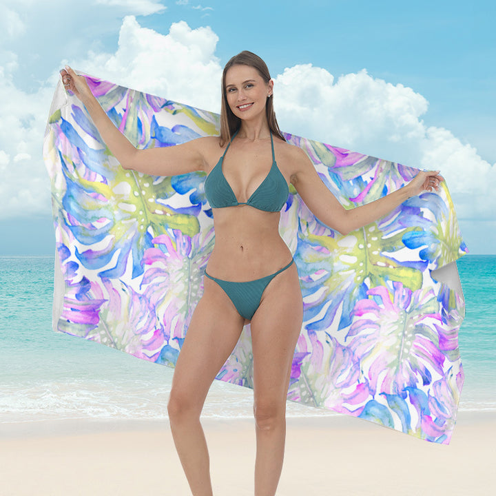 Beach towel with vibrant tropical plant motif Kalsten