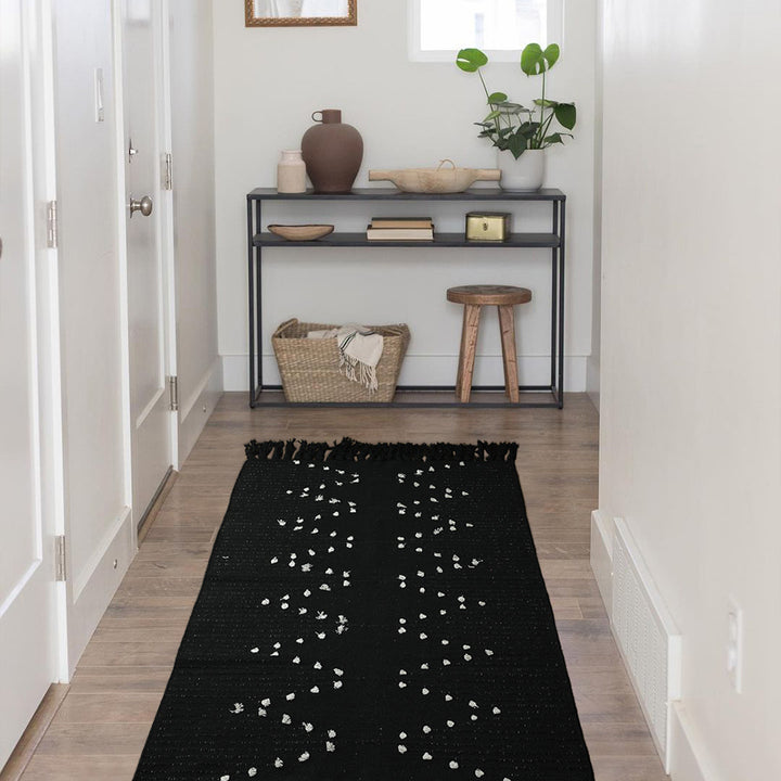 handwoven living room rug with fringes and geometric perforated pattern Kalsten