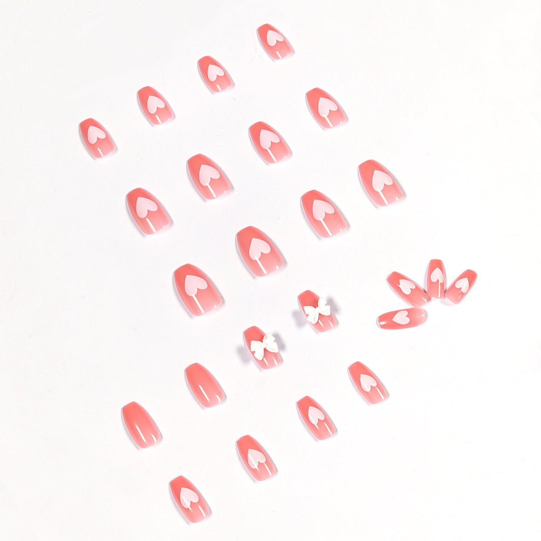 Artistic acrylic nails with heart and bow motifs Kalsten