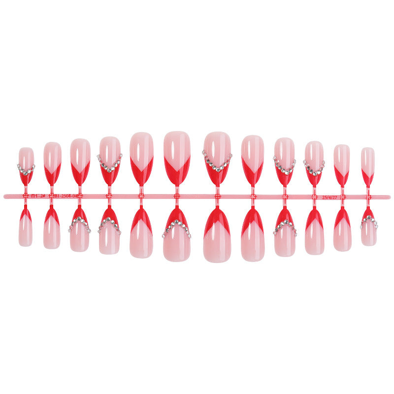 Nail art set with elegant red accents and rhinestone embellishments Kalsten