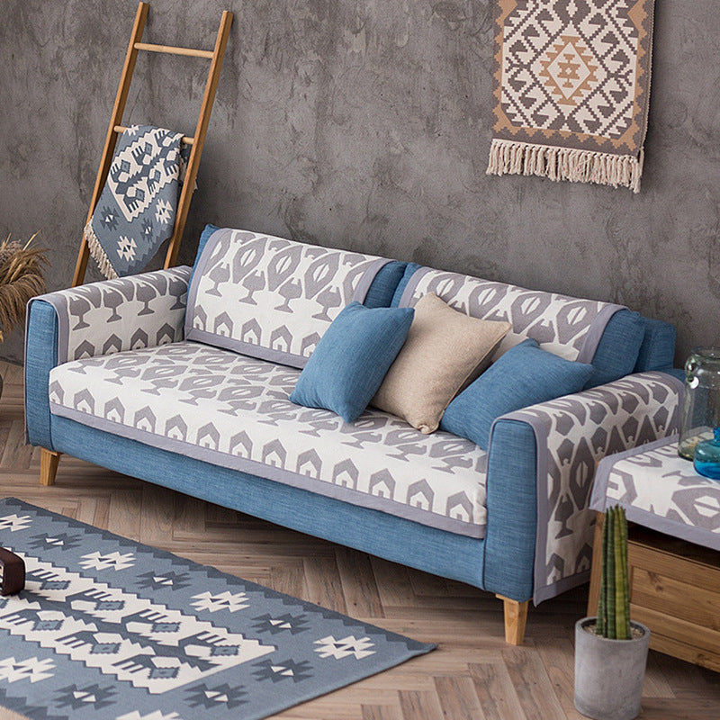 Washable non-slip sofa cover for three-seater couch with leaf pattern