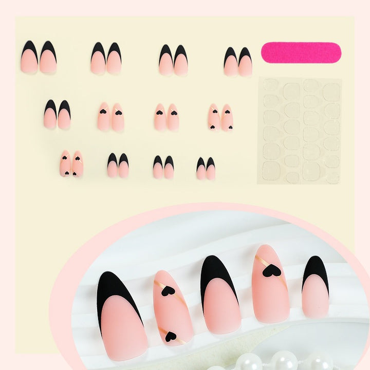 Creative nail art set with heart-shaped accents and elegant French tips Kalsten