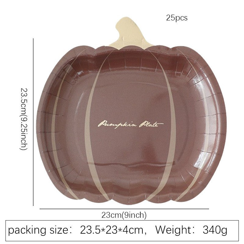 Disposable paper plates in pumpkin shape with spooky face design