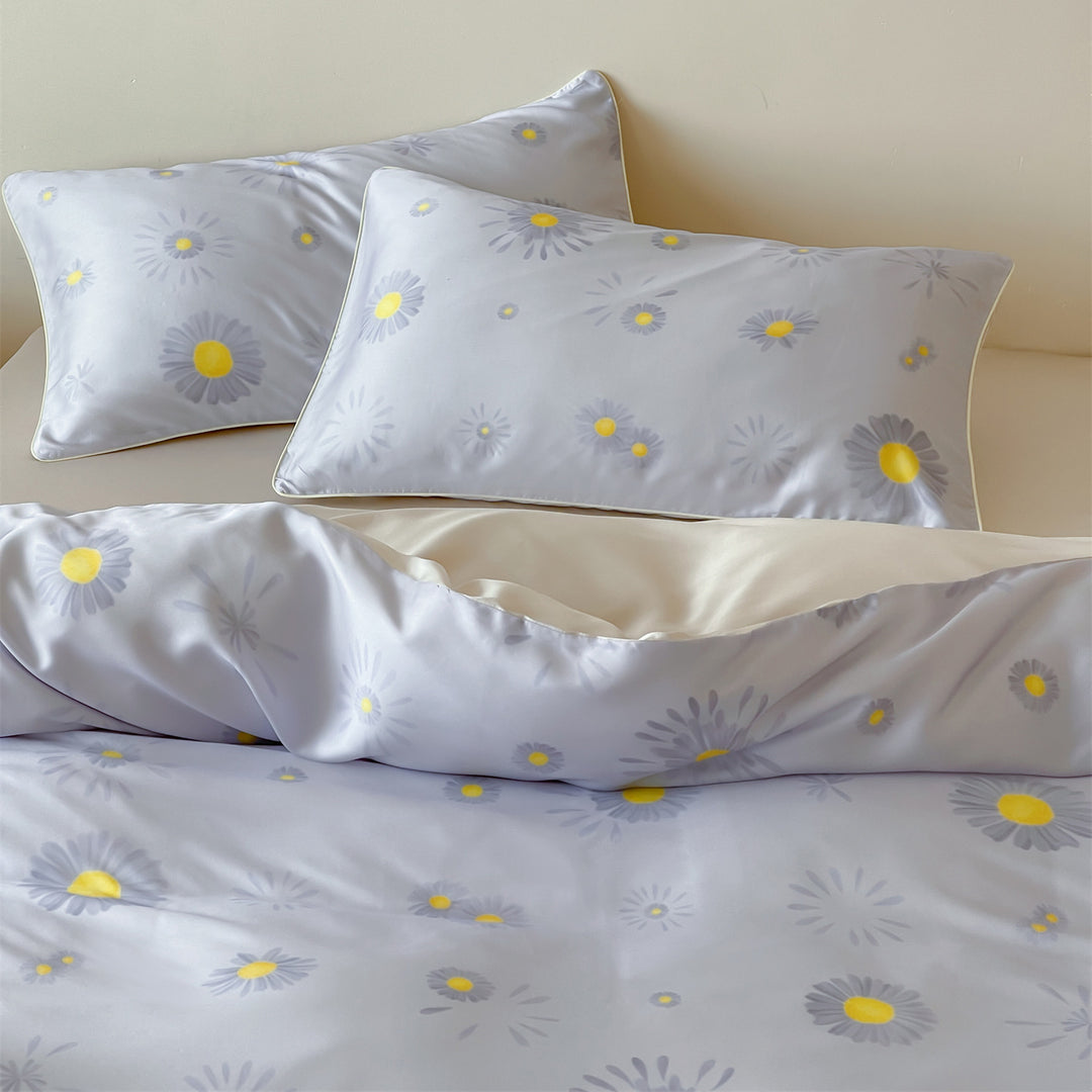 Luxurious satin bedding set with floral watercolor print, ruffled edges and reversible function