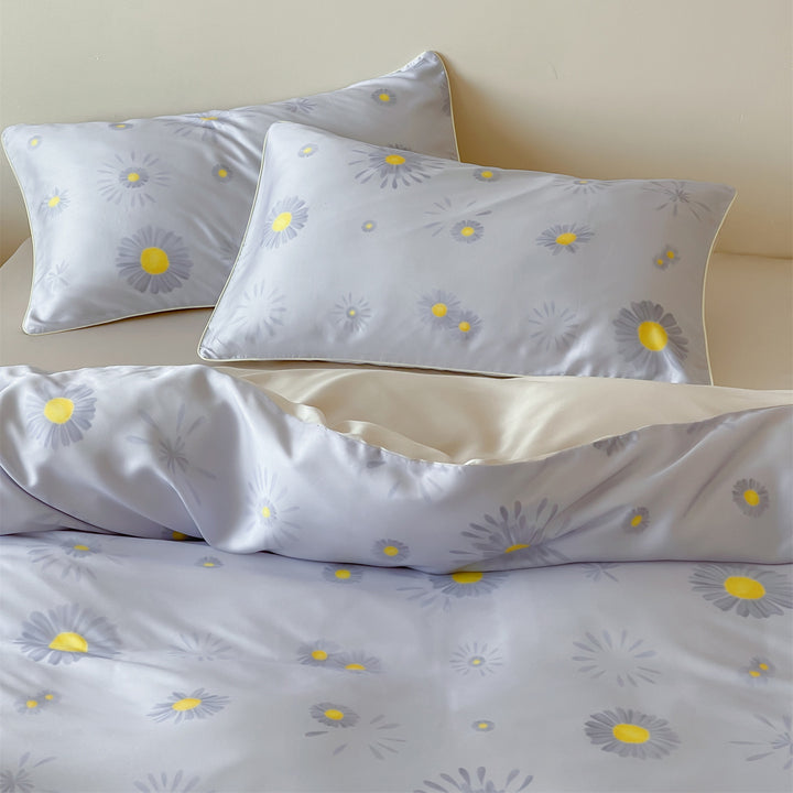 Luxurious satin bedding set with floral watercolor print, ruffled edges and reversible function