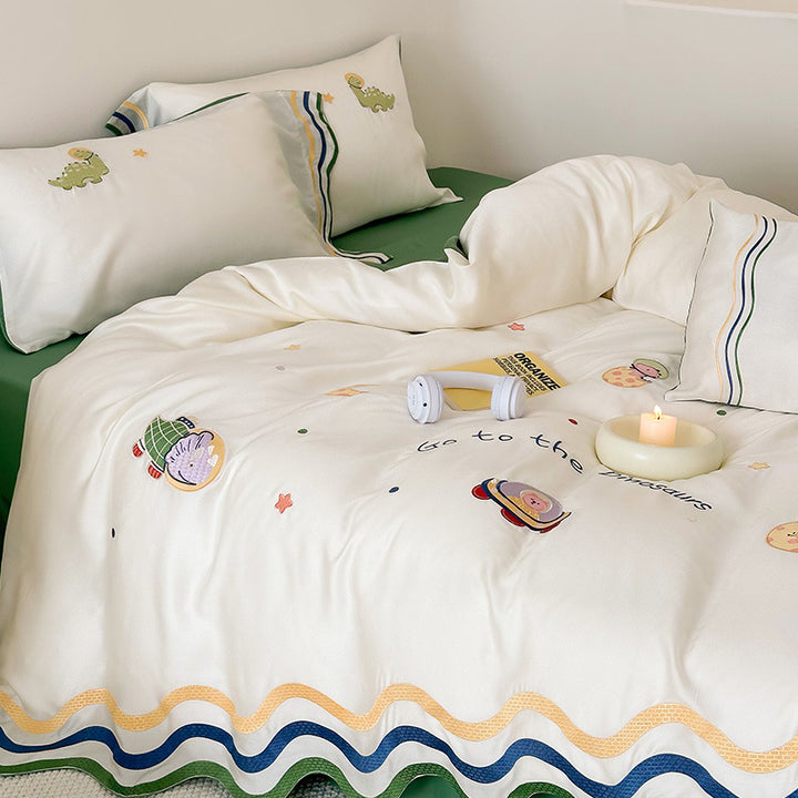 Children's bedding set with embroidered doll appliqués, ruffle and cuddle pillow