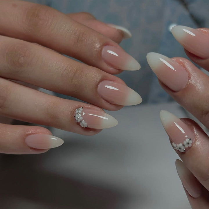 Acrylic nail set with elegant French tip and extravagant decorative details Kalsten