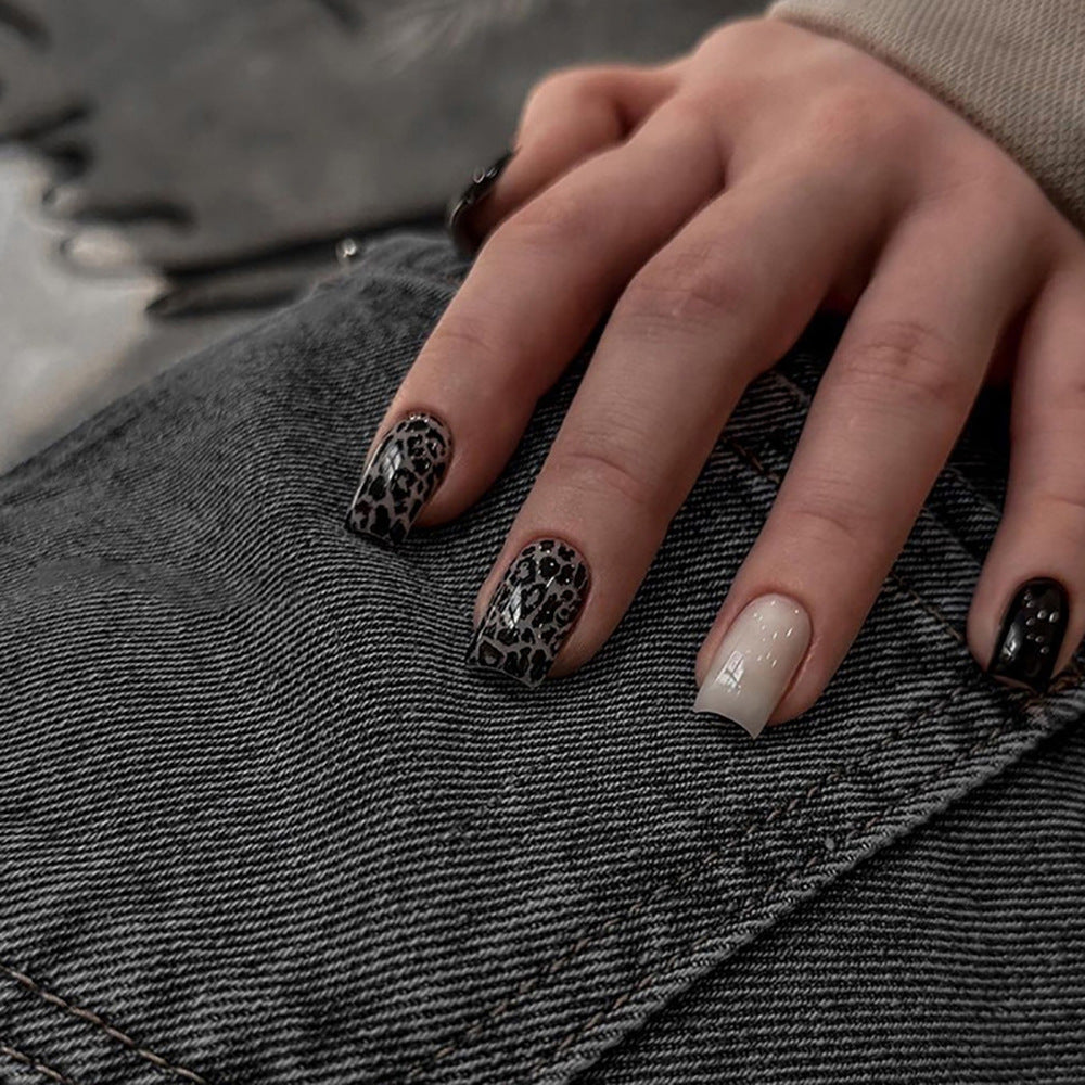 Acrylic nail set with stylish leopard pattern and elegant accents Kalsten