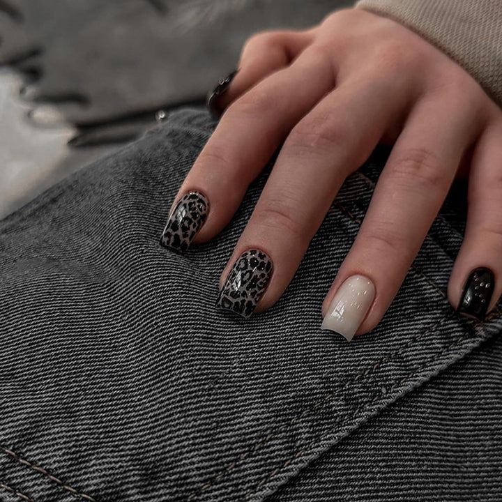 Acrylic nail set with stylish leopard pattern and elegant accents Kalsten
