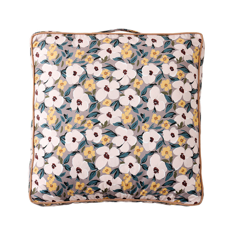 Large square floor cushion with floral cotton cover, piping, and carrying handle Kalsten