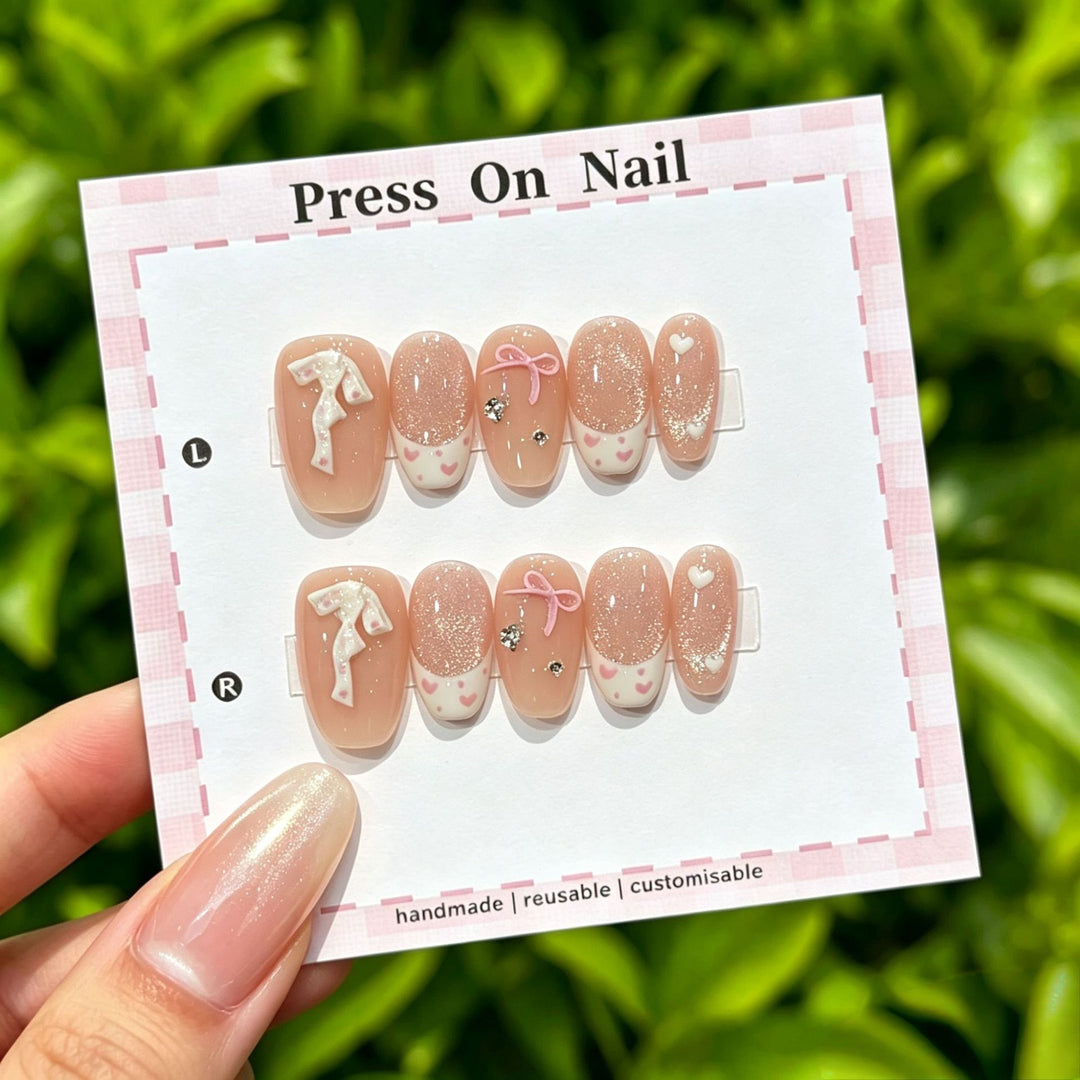 Artistic Press-On Nail Art Set with Cute Character and Bow Accents