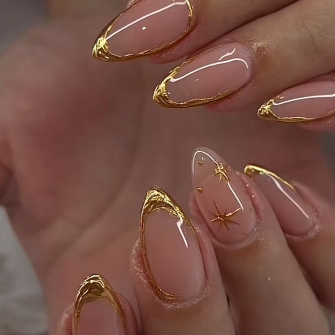 Glamorous stiletto nails with golden accents Kalsten