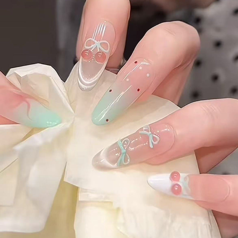 Artificial nail set with elegant bow and cherry designs Kalsten
