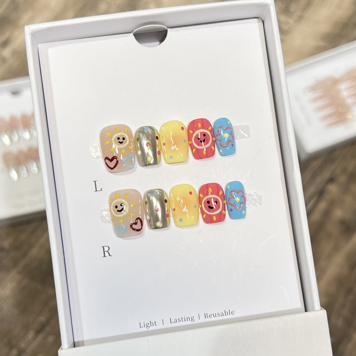 Whimsical Press-On Nail Art Set with Smiley Faces and Floral Designs Kalsten
