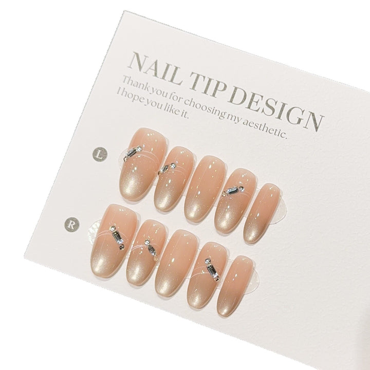 Artificial nail tips with elegant gradient color and rhinestone accents Kalsten