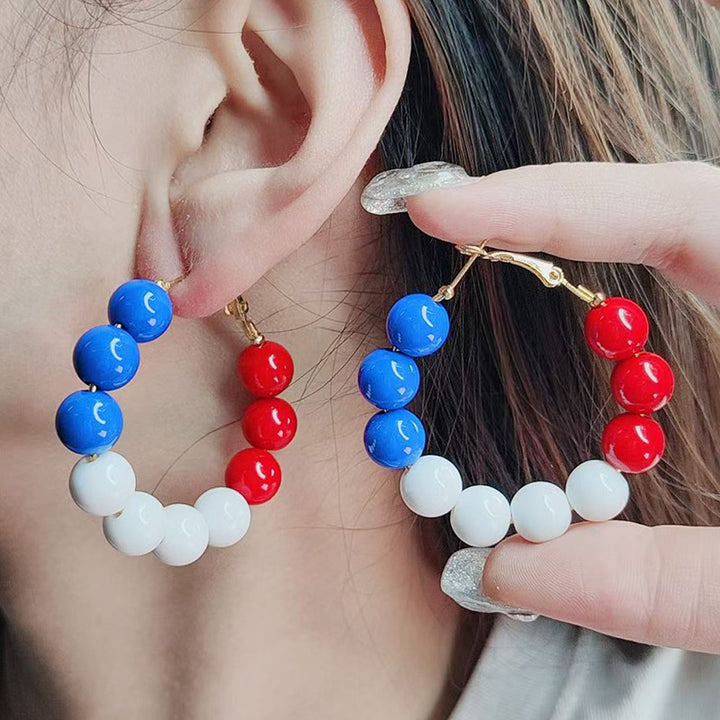 Women's pearl hoop earrings with large acrylic balls and secure clasp closure Kalsten