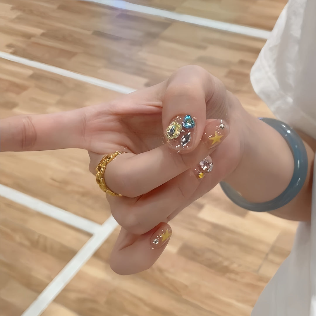 Glittering nail tips with elegant jewelry accents Kalsten