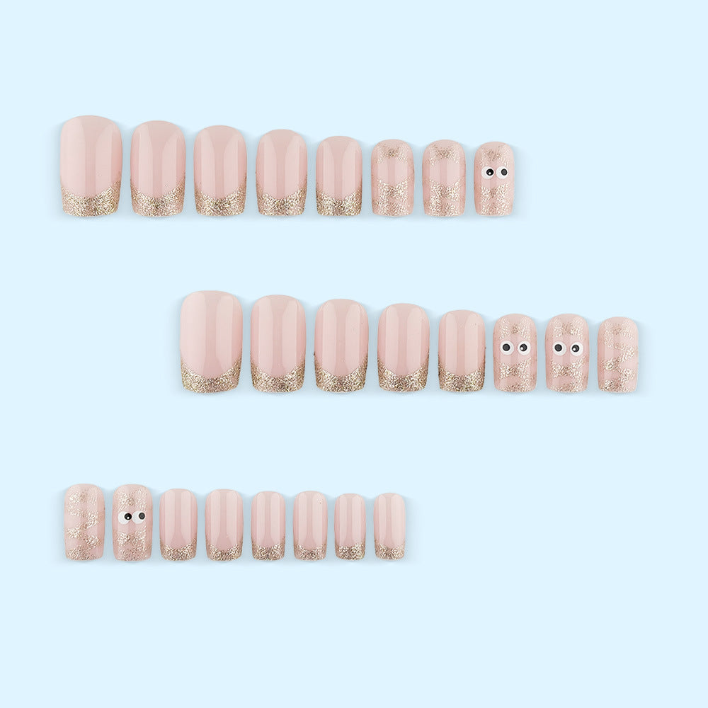 Artificials nails with playful eye design and glitter tips Kalsten