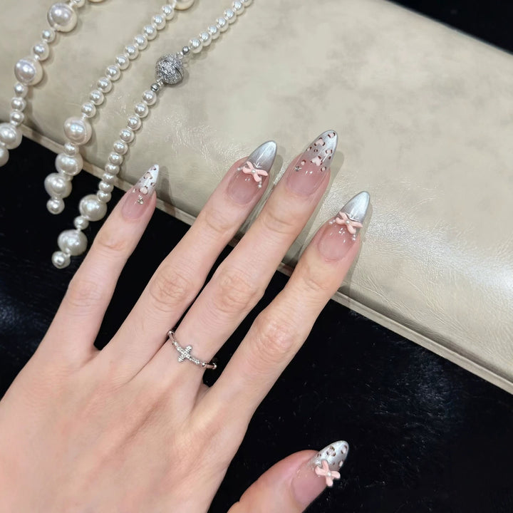 Decorative Press-On Nail Design with Bow Accents Kalsten