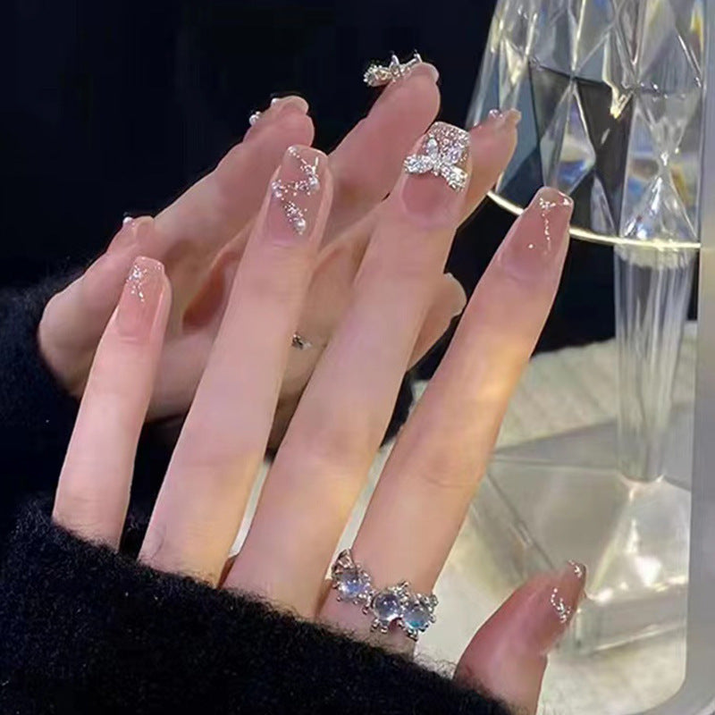 Artificial nails in an elegant design with 3D butterflies and glitter accents Kalsten
