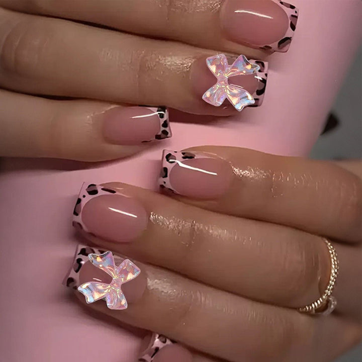 Artificial nail set with impressive floral and bow accents Kalsten