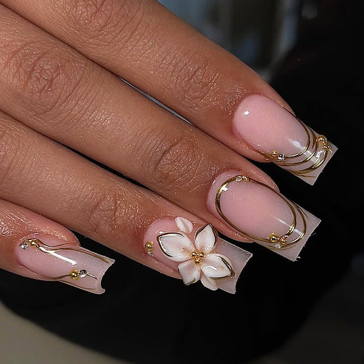 Elegant artificial nail set with decorative flower and gold embellishments Kalsten