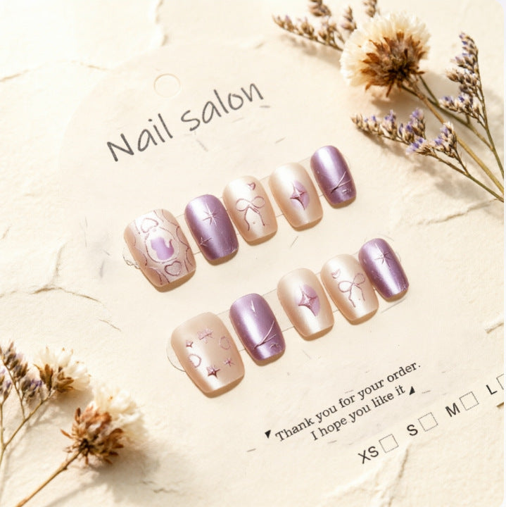 Artificial nails with playful bow and star design Kalsten