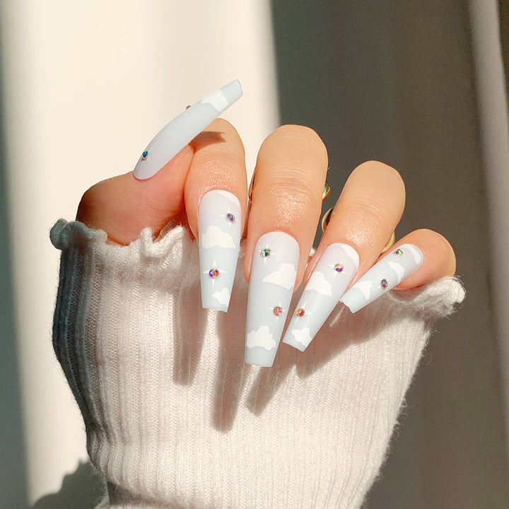 Creative nail art in cloud design with glitter accents Kalsten
