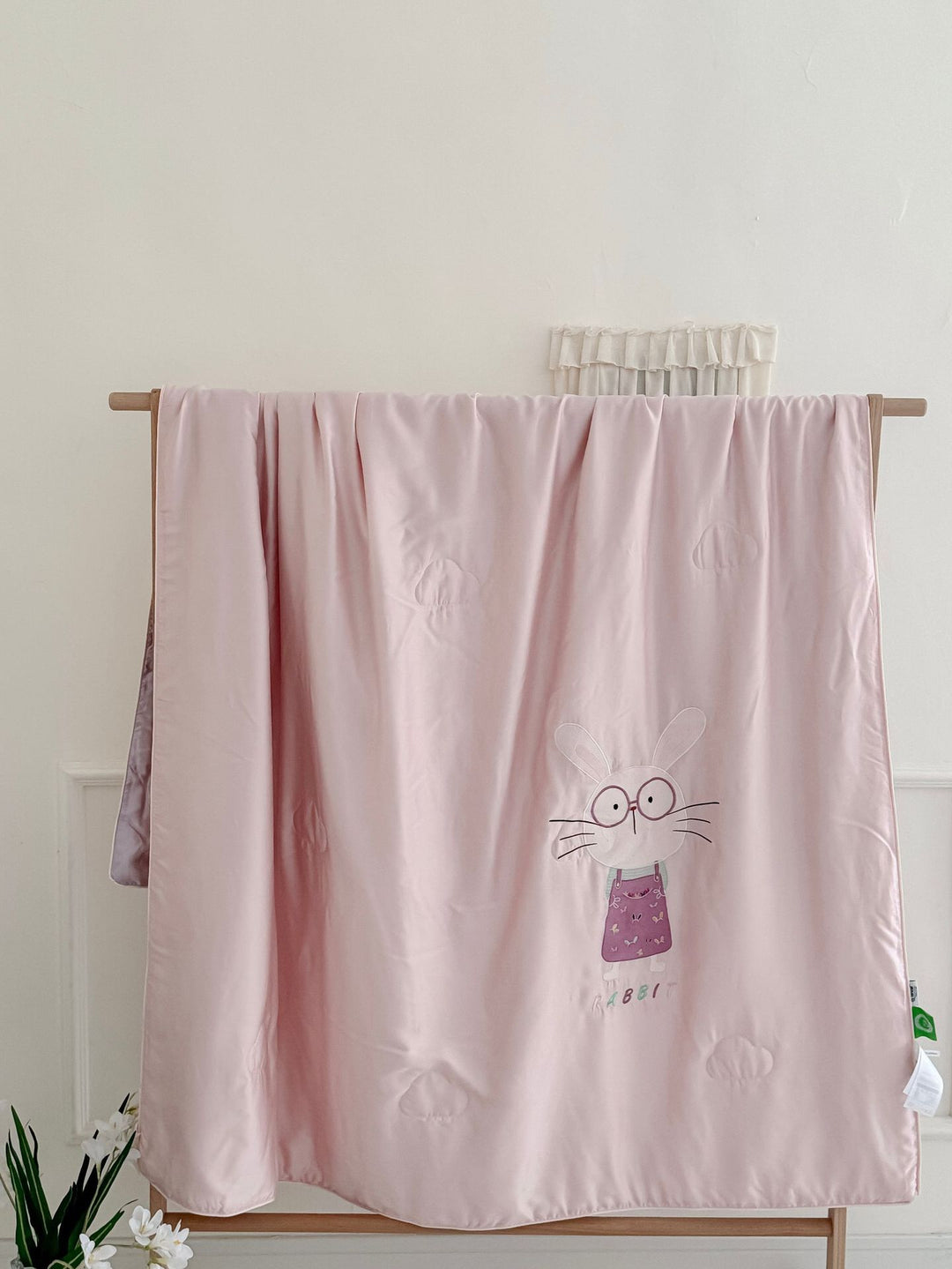 Children's comfort quilt with sweet bunny embroidery and silky satin cover