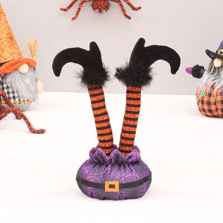 Skurrile Halloween table figure with standing witch legs and spider web sack