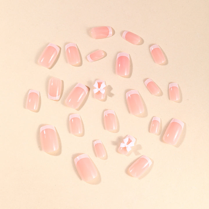 Elegant French Tip Nail Art with Bow Embellishments Kalsten