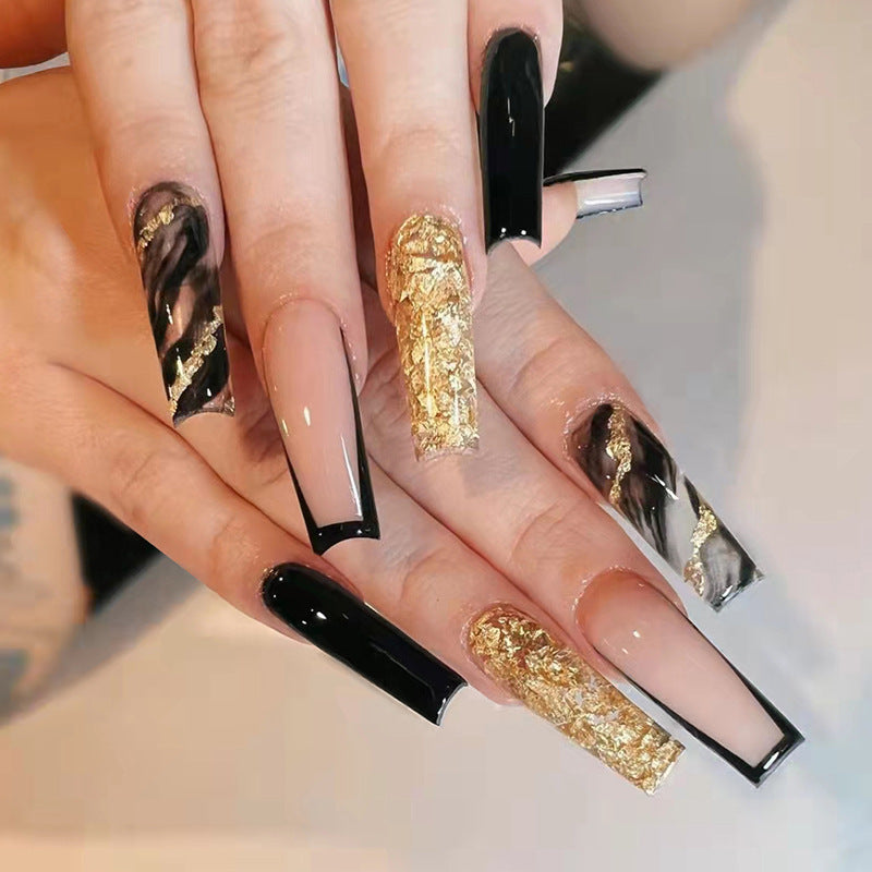 Acrylic nail set with luxurious golden accents and elegant designs Kalsten