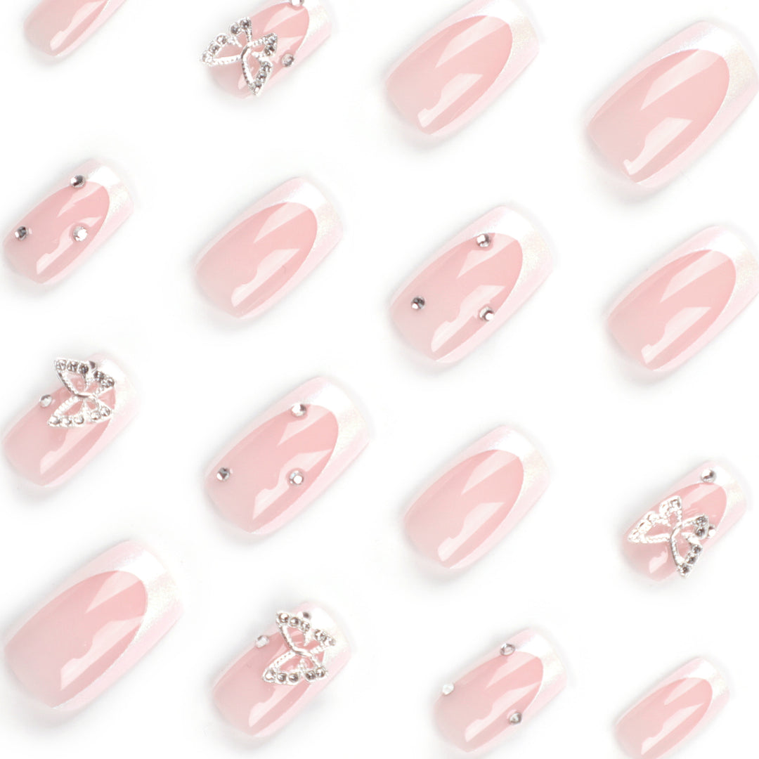 Elegant Nail Art with Glitter and Floral Accents Kalsten