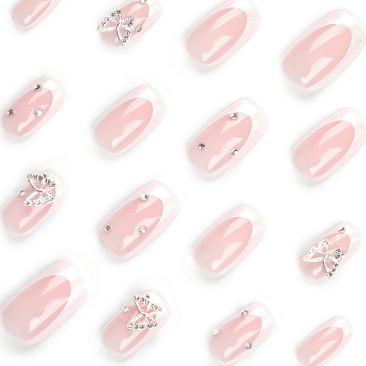 Elegant Nail Art with Glitter and Floral Accents Kalsten