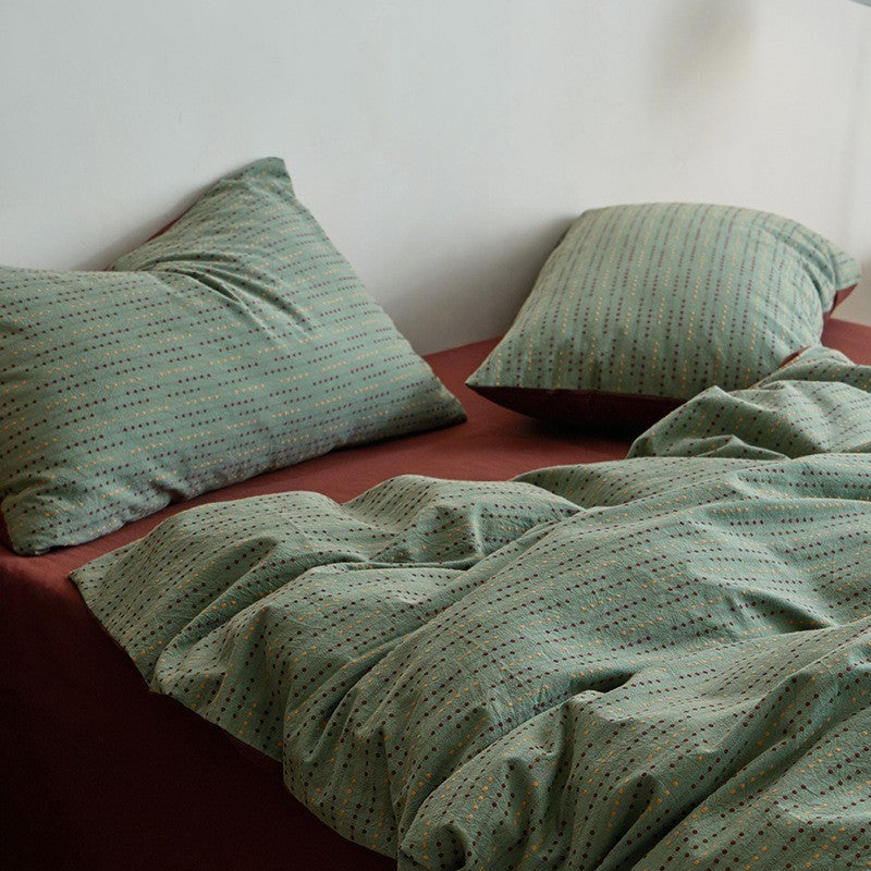 Reversible bed linen set made of breathable cotton blend with fine dot texture