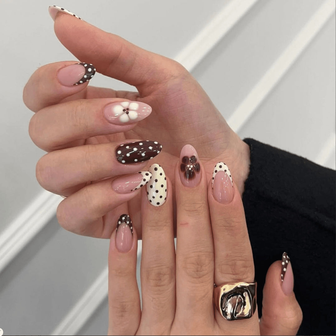 Artful nail art with floral design and various patterns Kalsten