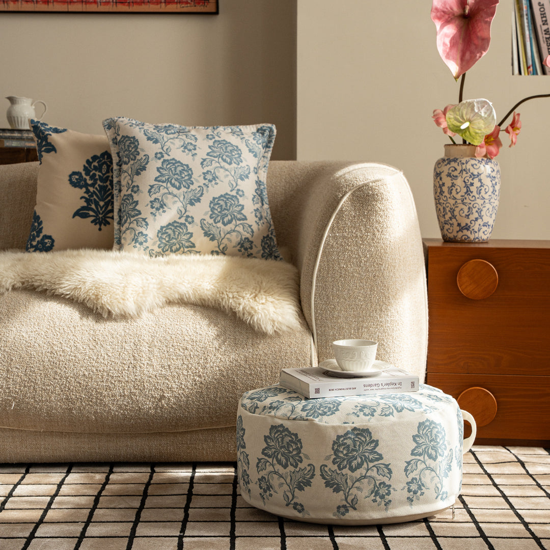 Round seat pouf with floral jacquard weave, stable upholstery core, and carrying handle Kalsten