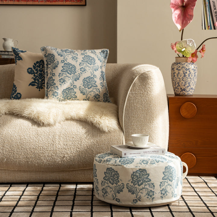 Round seat pouf with floral jacquard weave, stable upholstery core, and carrying handle Kalsten