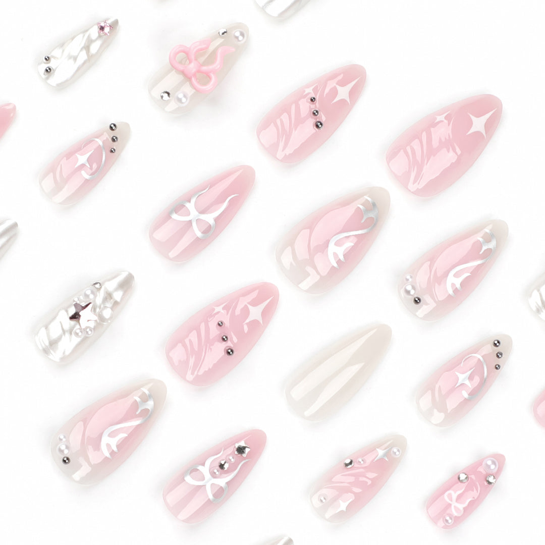 Artful stiletto nails in an elegant design with creative embellishments Kalsten