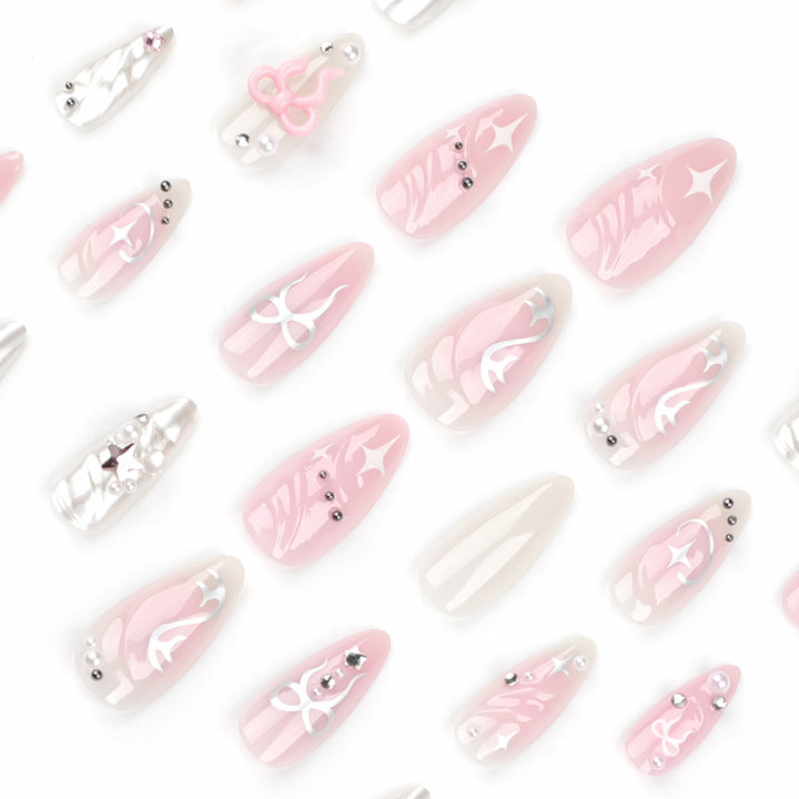 Artful stiletto nails in an elegant design with creative embellishments Kalsten