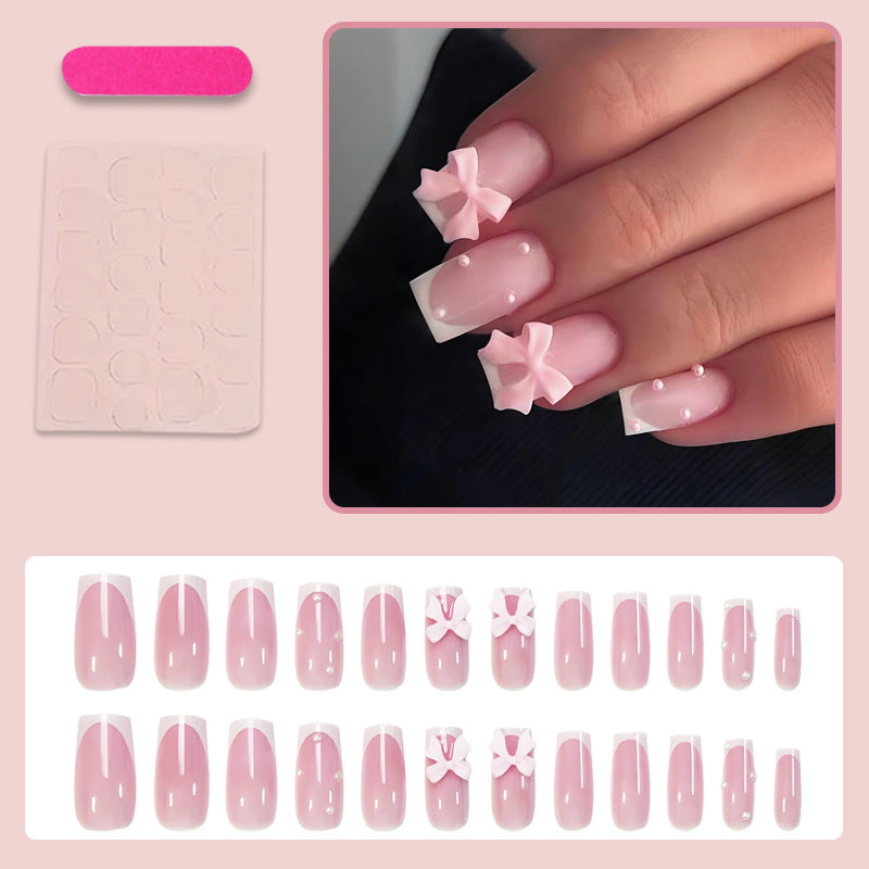Glamorous artificial nail set with elegant bows and glitter accents Kalsten