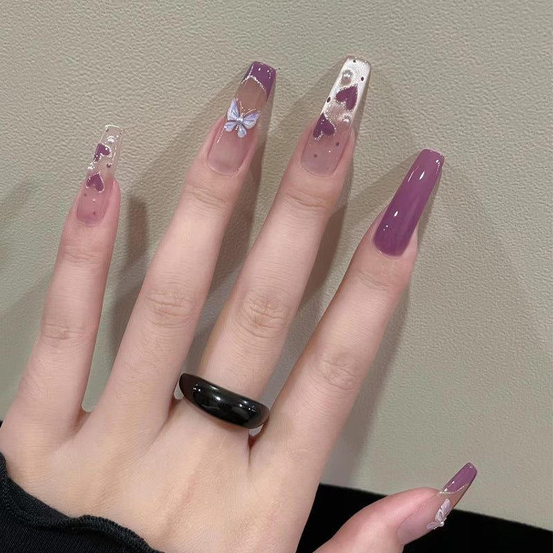 Artistic Press-On Nail Design with Butterfly Accents Kalsten